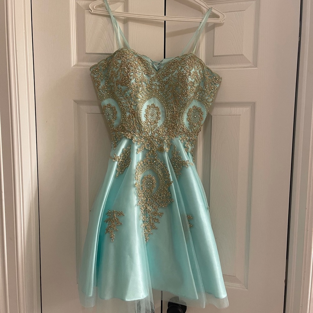Turquoise and gold strapless dress from Camilles.